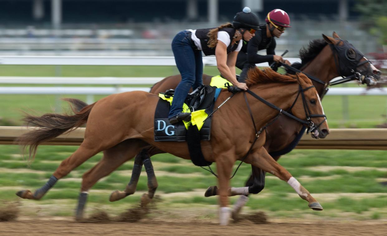 Kentucky Derby hopefuls Society Man, left, and Dornoch, right, get in a final workout one week before the race at Churchill Downs. The horses are trained by Danny Garage.