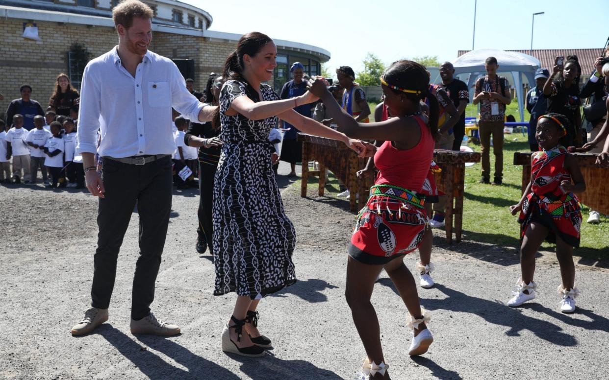 The Duchess joins in the dancing in Nyanga - i-Images Picture Agency