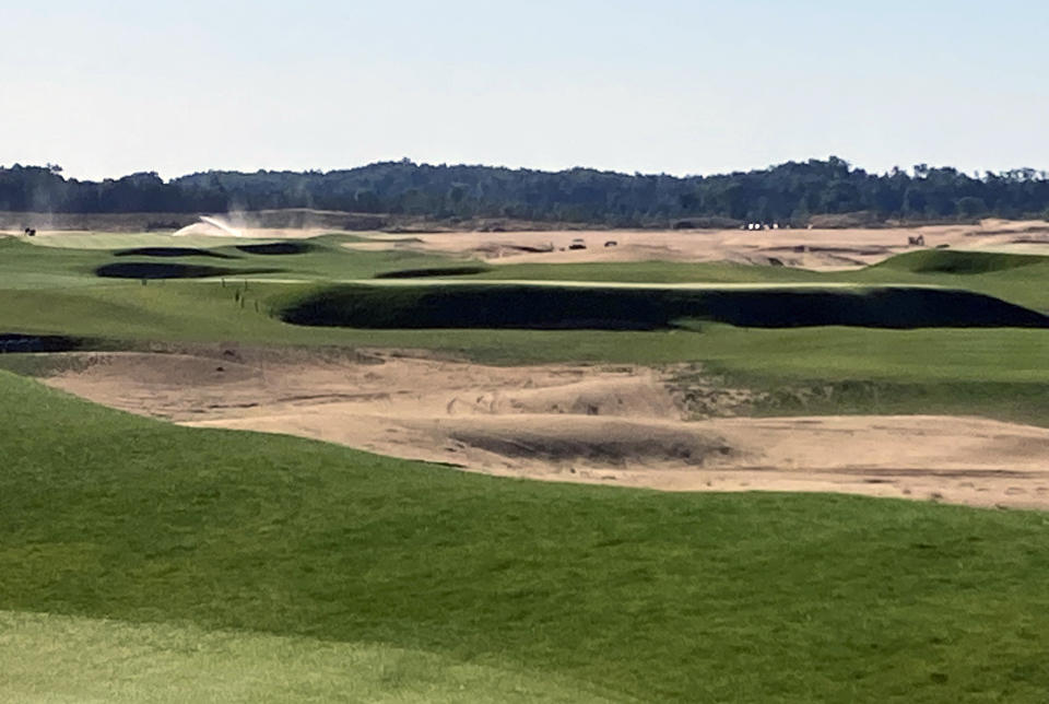 This Sept. 27, 2021 photo shows The Lido Golf Club under construction at Sand Valley Golf Resort in Nekoosa, Wis. The course was designed through old photos and documents, with the help of a course-building video game. The Lido will be an exact restoration of an abandoned course of the same name on Long Island, long considered one of the best golf courses in the world. (AP Photo/John Marshall)