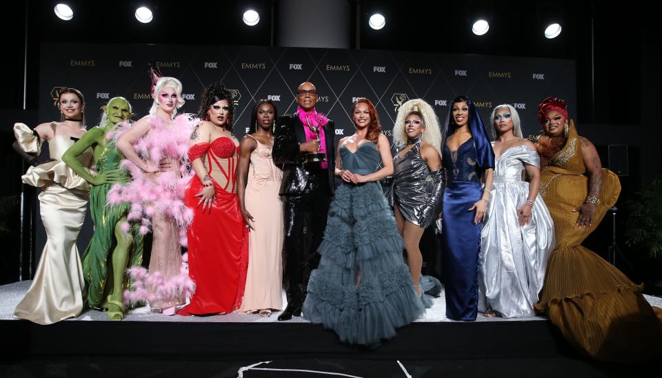 RuPaul, center, and the team from "RuPaul's Drag Race," winner of outstanding reality TV competition program at the 75th Emmy Awards at the Peacock Theater in Los Angeles on Jan. 15, 2024.