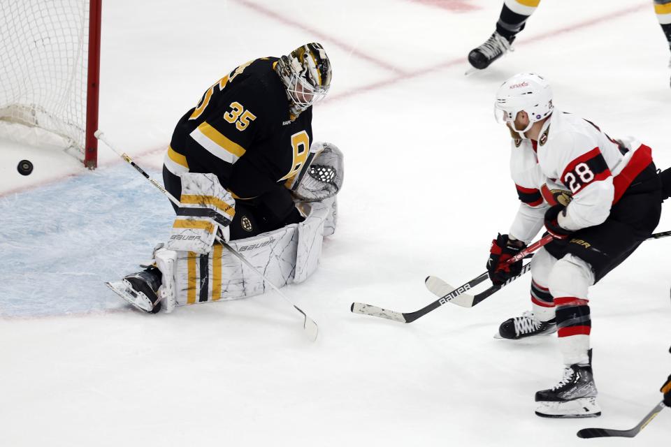 Ottawa Senators' Claude Giroux (28) scores on Boston Bruins' Linus Ullmark (35) during the first period of an NHL hockey game, Monday, Feb. 20, 2023, in Boston. (AP Photo/Michael Dwyer)