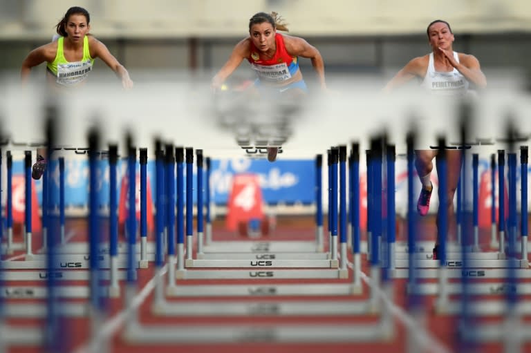 Russia's Ekaterina Galitskaya (C) competes in the women's 100m hurdles final at a track and field meet called "Stars of 2016" in Moscow on July 28, 2016