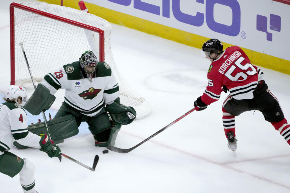 Minnesota Wild goaltender Marc-Andre Fleury makes a save on a rebound shot by Chicago Blackhawks defensemen Kevin Korchinski during the second period of an NHL preseason hockey game Thursday, Oct. 5, 2023, in Chicago. (AP Photo/Charles Rex Arbogast)