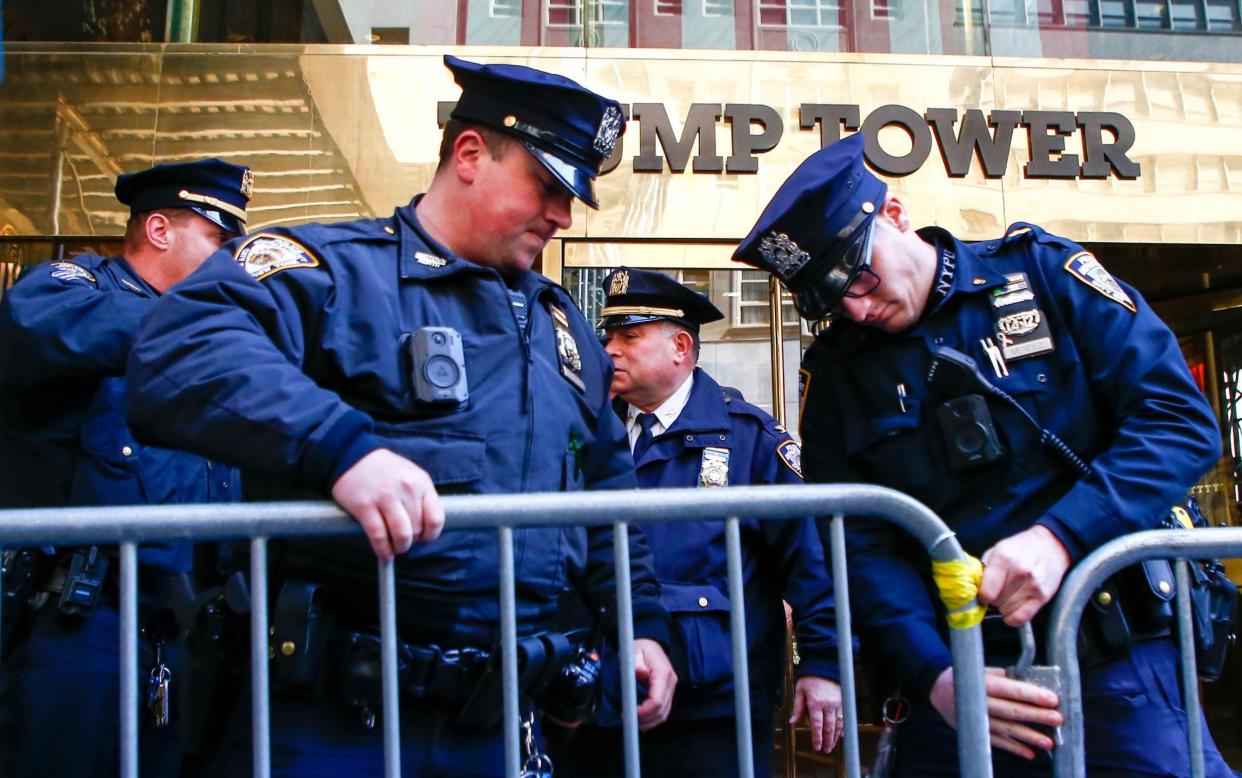NYPD officers set up barricades outside Trump Tower in Manhattan - ZUMA Press, Inc/Alamy Live News