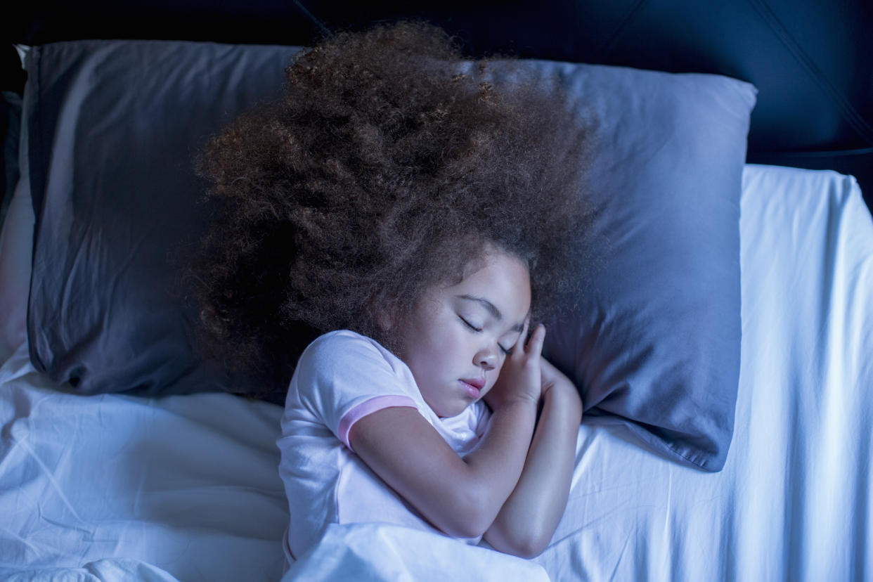 Want to see your kid like this every night? A year into the disrupting pandemic, it's time to get serious about a bedtime routine, say pediatric sleep experts. (Photo: Getty Images)