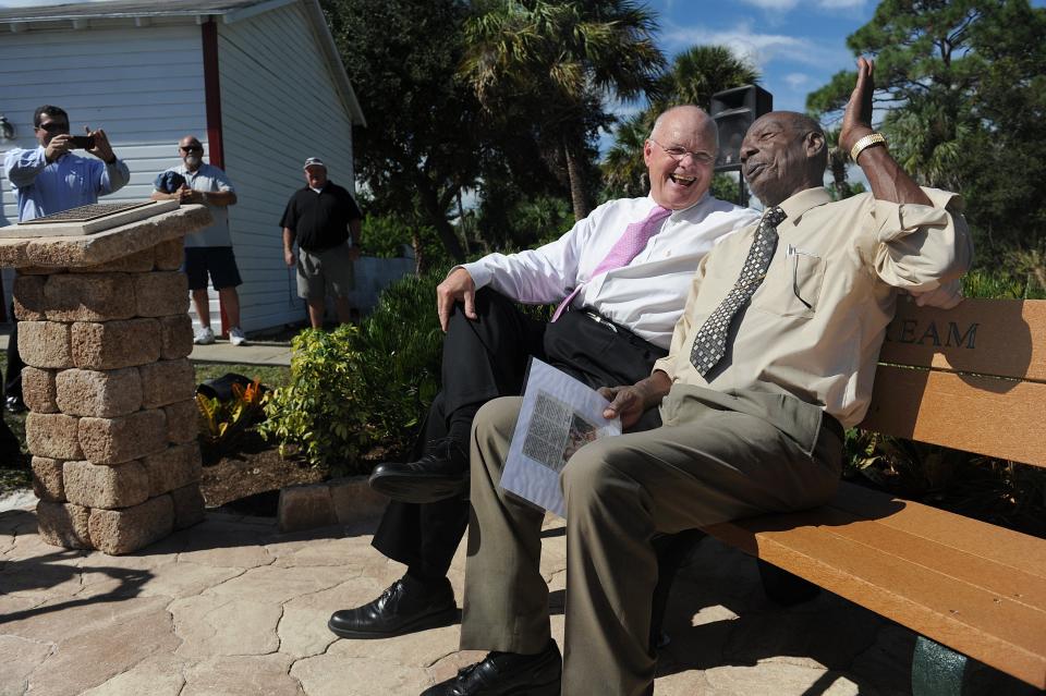 Longtime Gifford NAACP leader Victor Hart Sr. (right) sits on a bench dedicated to himself on Nov. 1, 2013, alongside Indian River County Commissioner Bob Solari, while being honored during a living memorial service at the Historic Macedonia Church in Gifford. Hart, 82, was honored with a engraved bench and a plaque at the church located across the street from Gifford Middle School. "It feels good, people don't usually do nothing for me," Hart Said."Now somebody says thank you, at least they let me know they appreciate me."  