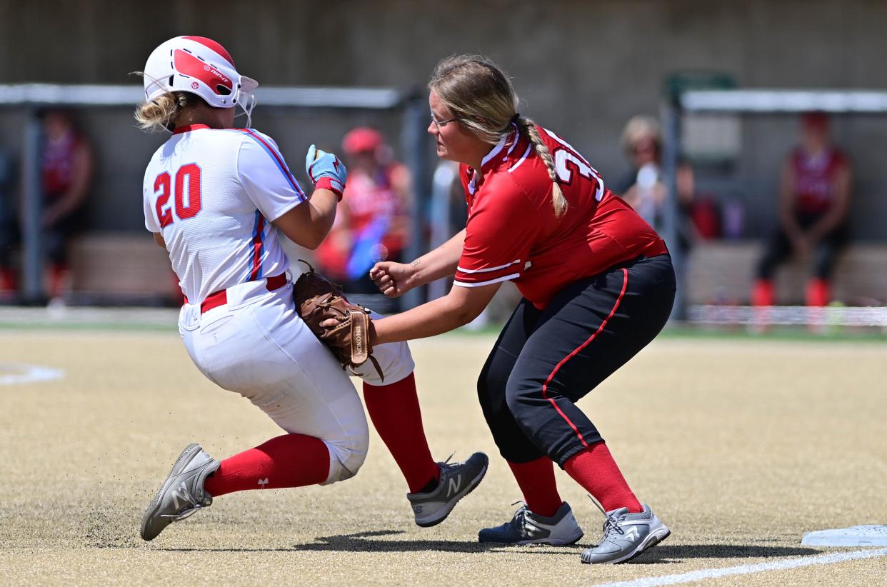 Yankton third baseman Tori Vellek tags out Sioux Falls Lincoln base runner Norah Christensen in their Class AA game during the opening day of the South Dakota High School State Softball Tournament on Thursday, June 1, 2023 in Aberdeen.