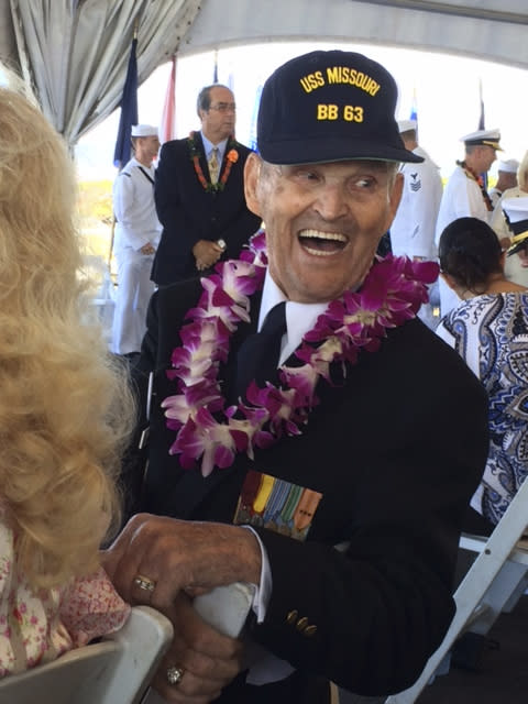 In this photo provided by Kathy Brent, World War II veteran Art Albert laughs during a surrender anniversary ceremony aboard the USS Missouri in Pearl Harbor, Hawaii, on Sept. 2, 2017. Albert, who had come to Hawaii for every commemoration, had promised loved ones that he would make it to the 75th anniversary of the surrender in 2020. But he died in June. Several dozen aging U.S. veterans will gather in Pearl Harbor in September to mark the event, even if it means the vulnerable group may be risking their lives again amid the coronavirus pandemic. (Kathy Bates via AP)