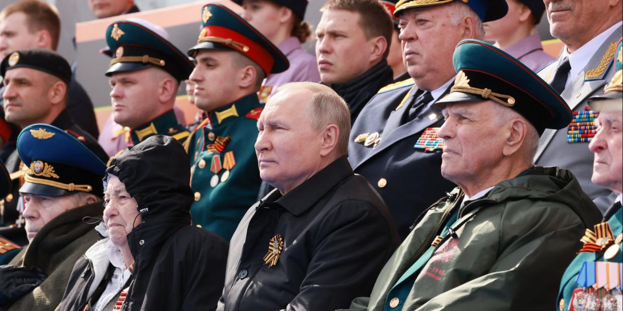 Russian President Vladimir Putin watches the Victory Day military parade at Red Square in central Moscow on May 9, 2022. - Russia celebrates the 77th anniversary of the victory over Nazi Germany during World War II.