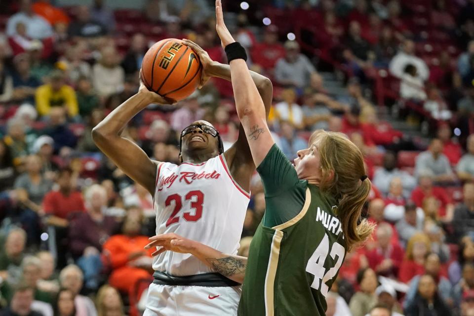 UNLV center Desi-Rae Young (23) shoots as Colorado State forward Karly Murphy (42) defends during the first half of an NCAA college basketball game for the championship of the Mountain West Conference women's tournament Wednesday, March 9, 2022, in Las Vegas. (AP Photo/Rick Bowmer)