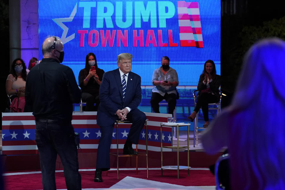 President Donald Trump sits during a break in an NBC News Town Hall, at Perez Art Museum Miami, Thursday, Oct. 15, 2020, in Miami. (AP Photo/Evan Vucci)