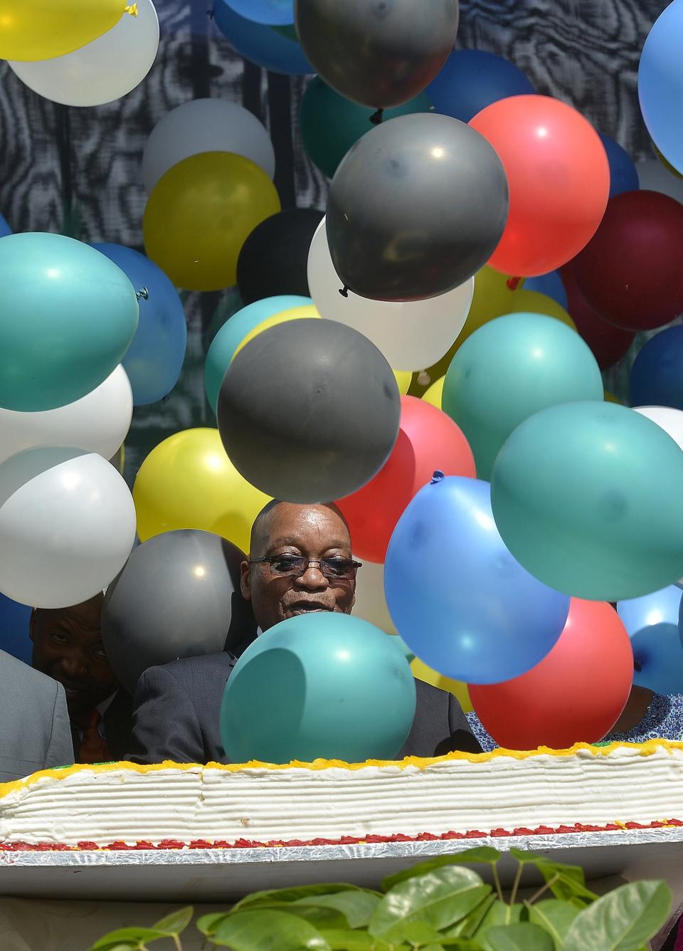 South Africa's President Zuma is seen behind balloons during Freedom Day celebrations in Pretoria