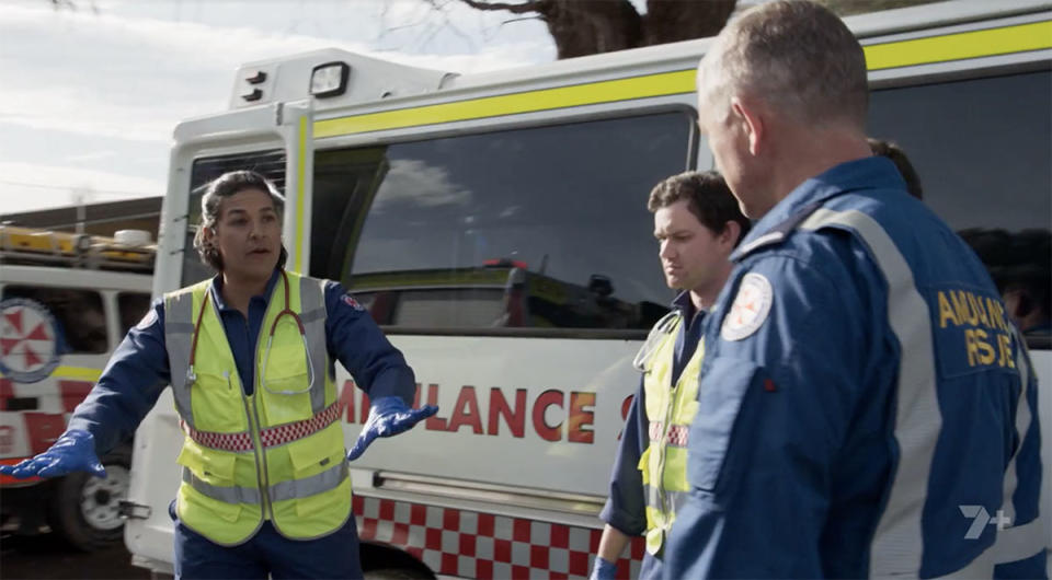 A group of paramedics by an ambulance on Home and Away