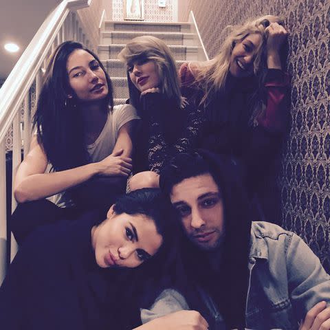 <p>Gigi Hadid/Instagram</p> Taylor Swift posing on the staircase with her friends