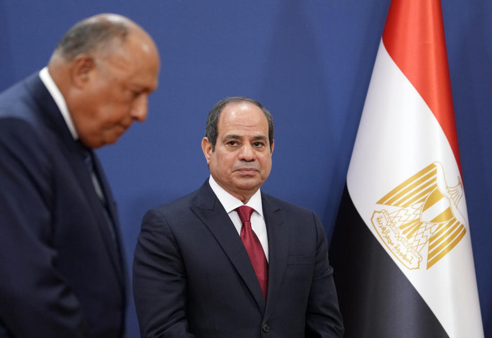 Egyptian President Abdel Fattah el-Sisi, right, watches Foreign Minister of Egypt Sameh Shoukry during a ceremony after talks with his Serbian counterpart Aleksandar Vucic at the Serbia Palace in Belgrade, Serbia, Wednesday, July 20, 2022. Abdel Fattah el-Sisi is on a three-day official visit to Serbia. (AP Photo/Darko Vojinovic)