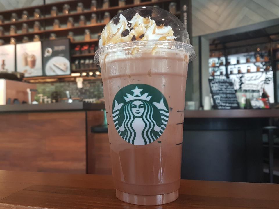 A salted-caramel mocha drink on a counter at Starbucks