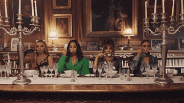 Four women scooping soup to their mouths