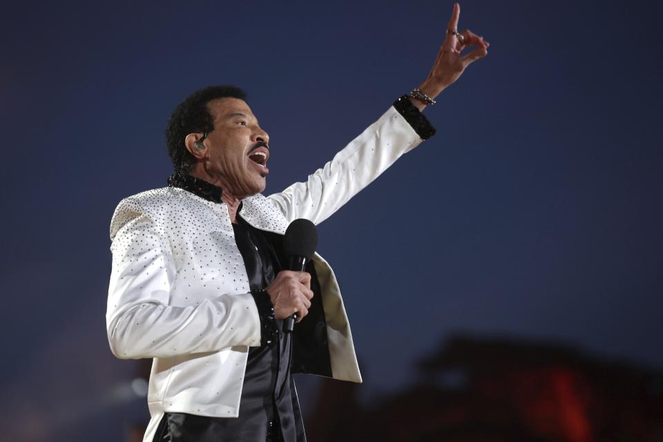 US singer Lionel Richie performs during a concert at Windsor Castle in Windsor, England, Sunday, May 7, 2023, celebrating the coronation of King Charles III. It's one of several events over a three-day weekend of celebrations. (Chris Jackson/Pool Photo via AP)