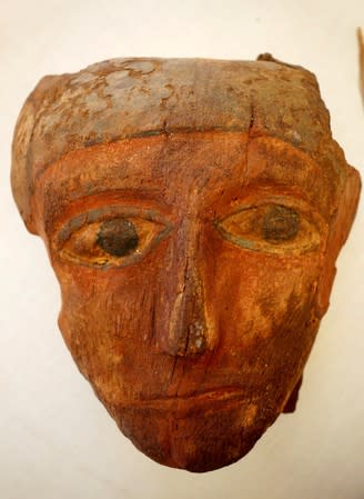 A mask that was discovered during excavations near the King Amenemhat II pyramid is displayed during a presentation, south of Cairo