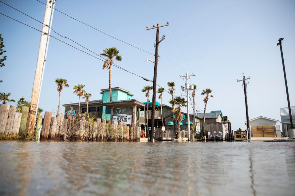 Flood waters fill the parking lot near Virginia's On the Bay in Port Aransas, TX on Sunday, Sept. 20, 2020.