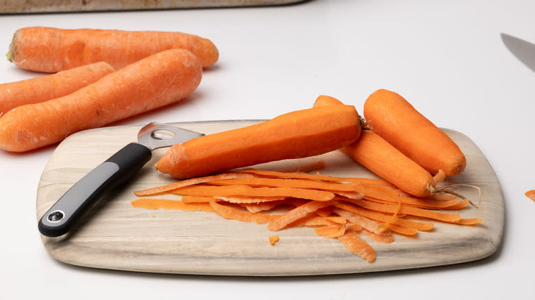 carrots being peeled
