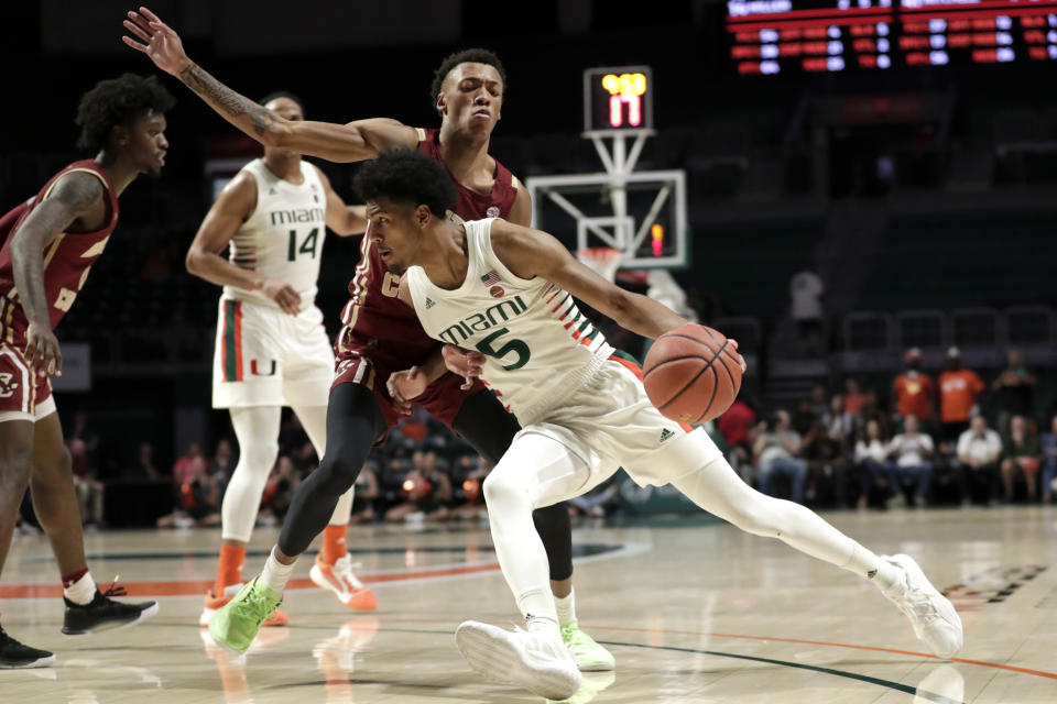 Miami guard Harlond Beverly (5) drives to the basket as Boston College forward Kamari Williams defends during the second half of an NCAA college basketball game, Wednesday, Feb. 12, 2020, in Coral Gables, Fla. Miami won 85-58. (AP Photo/Lynne Sladky)