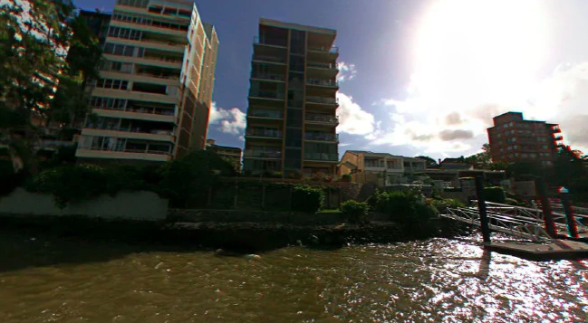 Brisbane real estate agency Ray White has been caught out appearing to Photoshop the Brisbane River in apartment photos.
