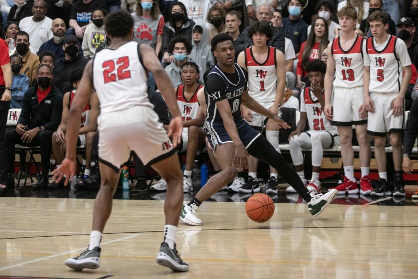 Sierra Canyon's Bronny James handles the ball against Harvard-Westlake in an Open Division semifinal regional playoff game.