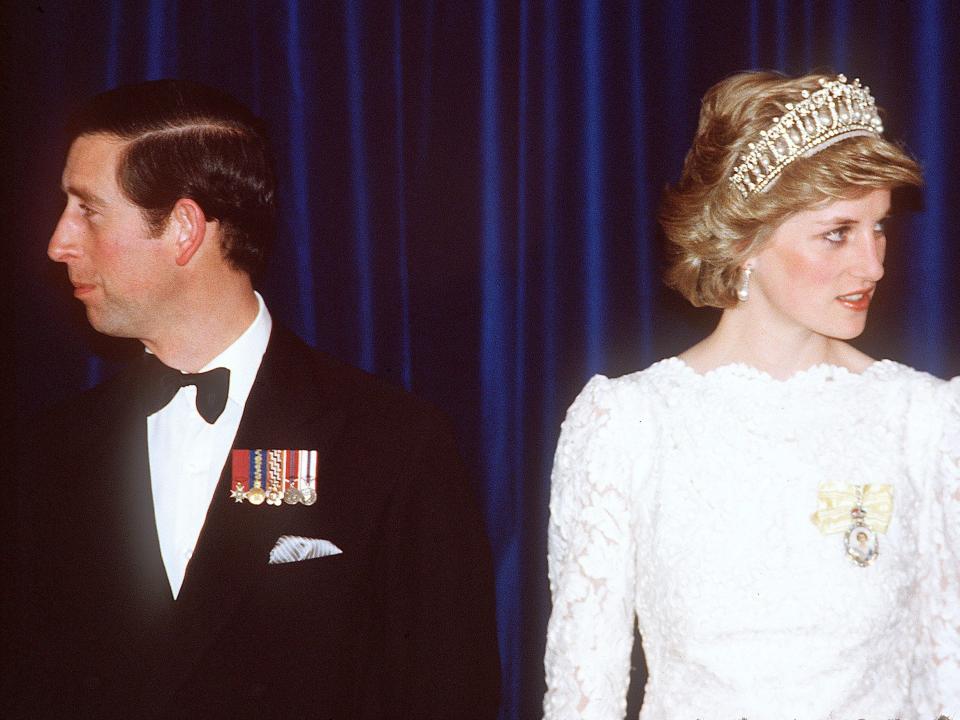 Prince Charles, Prince of Wales, and Diana, Princess of Wales, wearing a cream lace gown with a scalloped neckline designed by Murray Arbeid and the Cambridge Lover's Knot diamond and pearl tiara, attend a dinner with the Canadian Prime Minister Brian Mulroney, on May 3, 1986 in Vancouver, Canada.