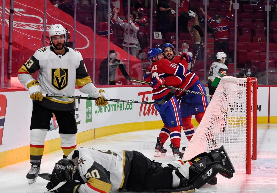 The Canadiens' Artturi Lehkonen (62) celebrates with teammate Phillip Danault (24) after scoring the winning goal in overtime of Game 6.