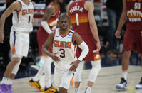 Phoenix Suns guard Chris Paul, front, reacts after hitting a basket late in the second half of Game 4 of an NBA second-round playoff series against the Denver Nuggets, Sunday, June 13, 2021, in Denver. Phoenix won 125-118 to sweep the series. (AP Photo/David Zalubowski)