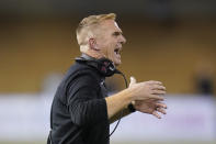 FILE - Utah State head coach Blake Anderson shouts to his team in the first half during an NCAA college football game against BYU on Oct. 1, 2021, in Logan, Utah. The No. 19 San Diego State Aztecs have called the Los Angeles suburbs their home for two seasons while they're building a new stadium in Mission Valley. They'll host Utah State in the Mountain West Conference championship game Saturday in Carson. (AP Photo/Rick Bowmer, File)