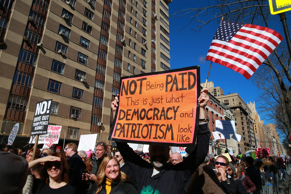 <p>A demonstrator holds up a sign and U.S. flag during the “Not My President’s Day” rally on Central Park West in New York City on Feb. 20, 2017. (Gordon Donovan/Yahoo News) </p>