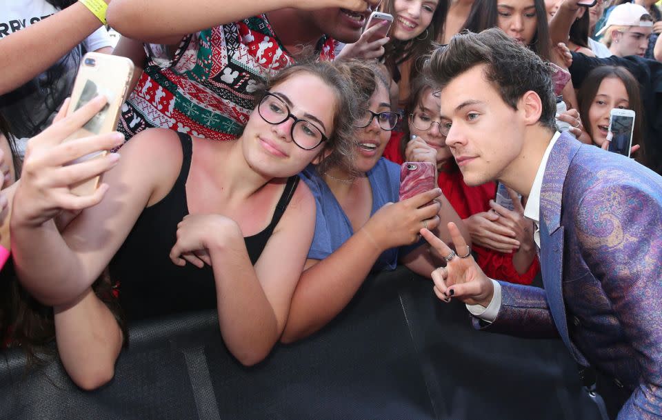 Earlier in the night, Harry had female fans crying with joy as he happily posed for photos on the red carpet. Source: Getty