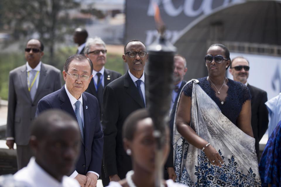 Rwandan President Paul Kagame, center, UN Secretary-General Ban Ki-moon, left, and Rwanda's First Lady Jeannette Kagame, right, observe the arrival of the memorial flame at a ceremony to mark the 20th anniversary of the Rwandan genocide, held at the Kigali Genocide Memorial Center in Kigali, Rwanda Monday, April 7, 2014. (AP Photo/Ben Curtis)