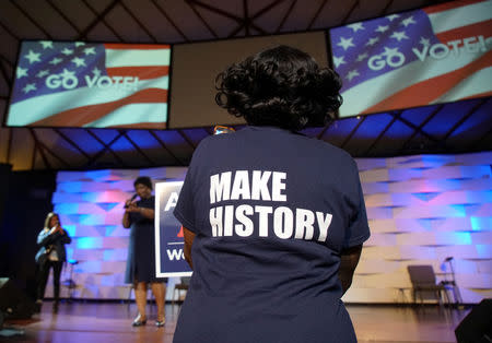 A Stacey Abrams supporter wears a "Make History" shirt while listening to Democratic gubernatorial candidate for Georgia, Stacey Abrams, speak ahead of the midterm elections in Conyers, Georgia, U.S., October 26, 2018. REUTERS/Lawrence Bryant