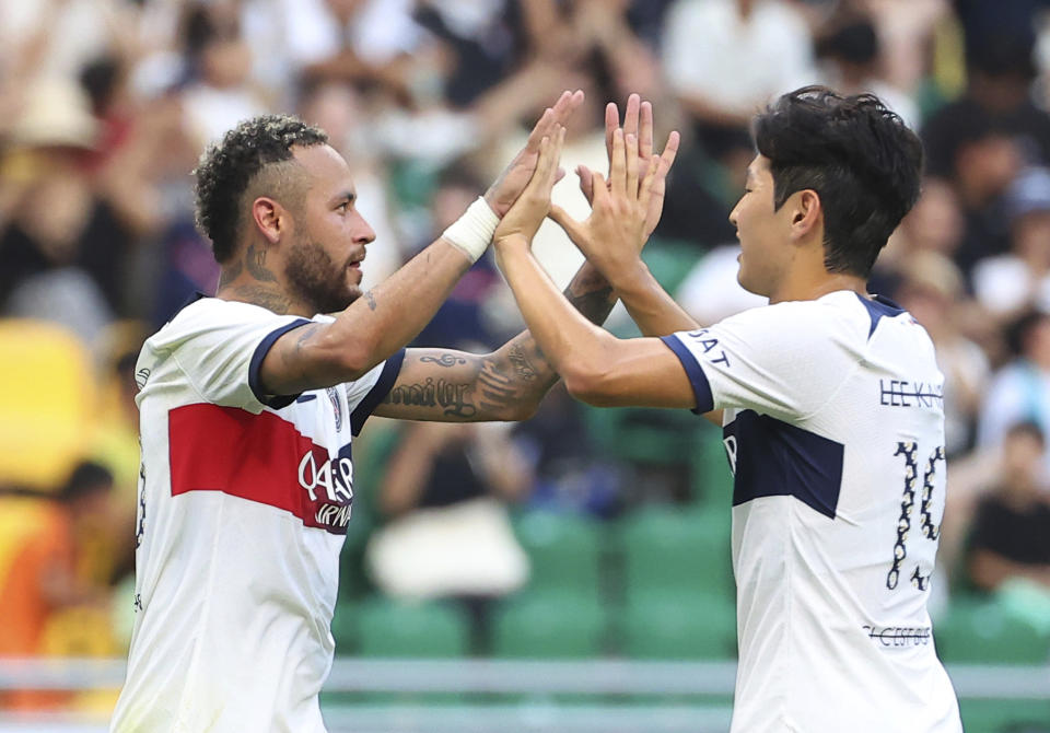 PSG's Neymar, left, celebrates with his teammate Lee Kang-in after scoring the goal during a friendly soccer match against Jeonbuk Hyundai Motors in Busan, South Korea, Thursday, Aug. 3, 2023. (Son Hyung-joo/Yonhap via AP)