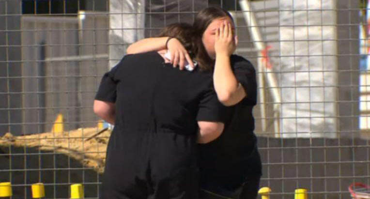 Friends console one another at the site of the accident in North Coogee on Monday. Source: 7NEWS
