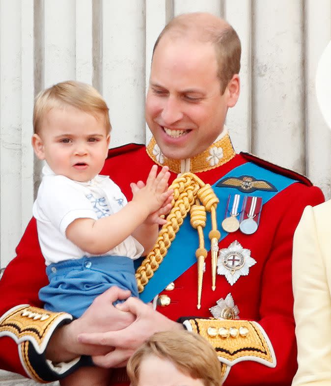 <p>Prince Louis makes his dad, Prince William, smile at his debut on the Buckingham Palace balcony for the annual Trooping the Colour ceremony. </p>