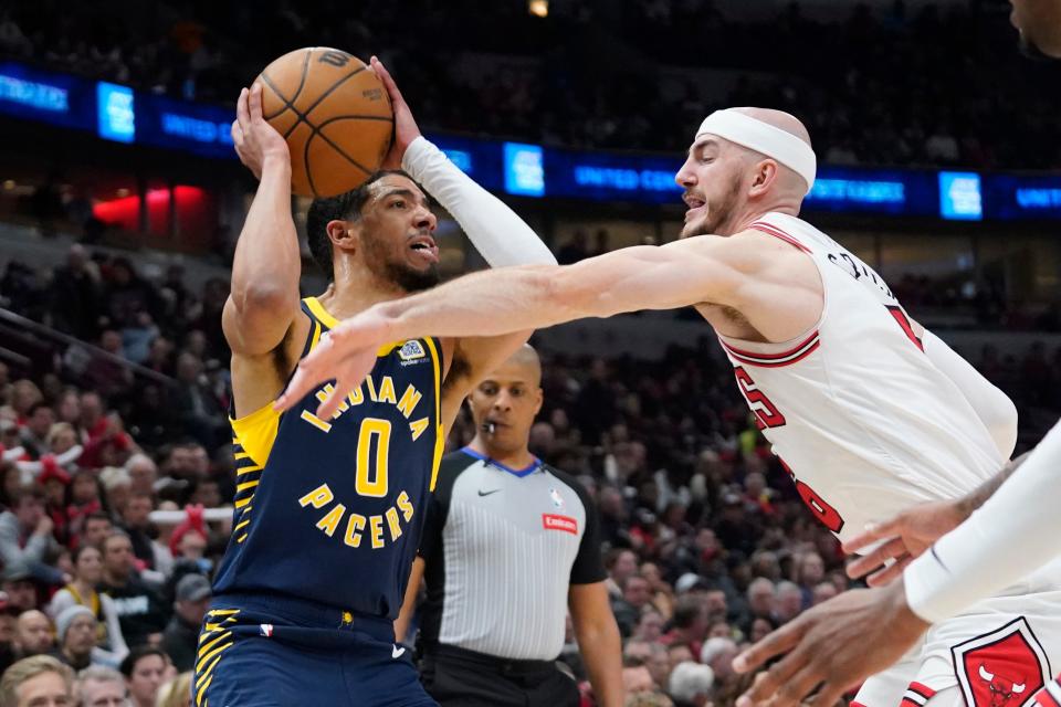 Mar 27, 2024; Chicago, Illinois, USA; Chicago Bulls guard Alex Caruso (6) defends Indiana Pacers guard Tyrese Haliburton (0) during the first quarter at United Center. Mandatory Credit: David Banks-USA TODAY Sports