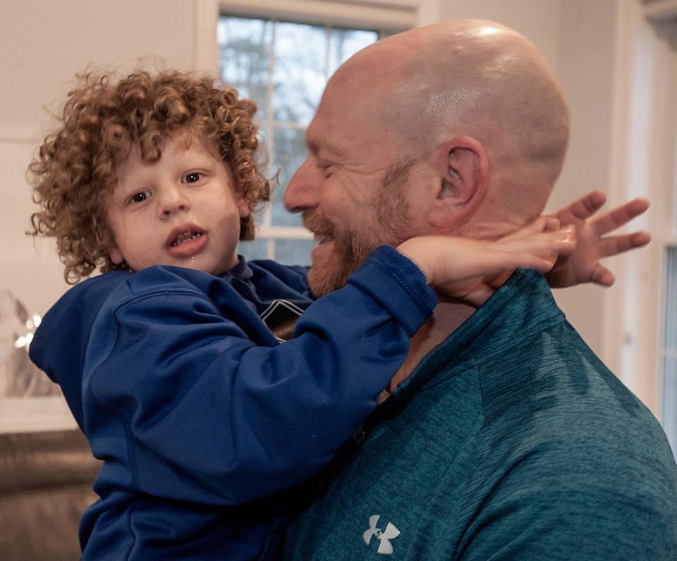 Lincoln Marks, 5, and his dad, Stephen, at home in Ashland, Jan. 11, 2024. Stephen Marks, the former AD at Ashland High, and his wife Jamie have started Linclusion, named after their autistic, non-verbal son Lincoln, 5. Linclusion helps send children to summer camp with an aid so those kids can be part of the camp with other children. Linclusion helps raise money to pay for the aids. Linclusion has already partnered with Pilgrim Day Camp in Framingham and Ashland Rec Center. Linclusion.org is their website.