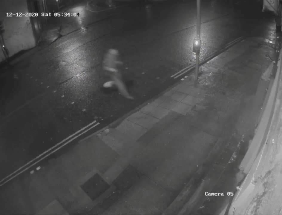 Shocking CCTV footage showed a meanspirited thief nicking Santa's boots from a homemade effigy outside a pub