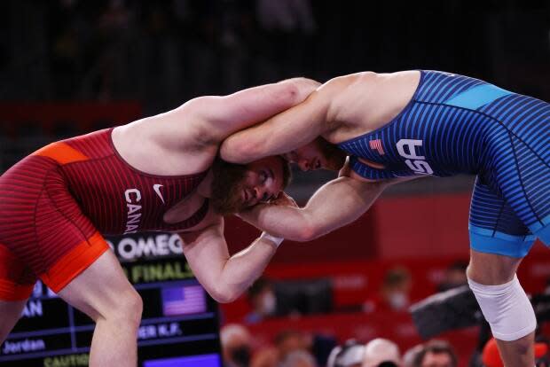 Canadian Jordan Steen competes against American Kyle Snyder in the opening round of the men's 97-kilogram freestyle wrestling competition at the Tokyo Games on Friday. (Reuters/Leah Mills - image credit)