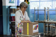 A woman casts her vote at a polling station during a nationwide election for new mayors, in Rubio, Venezuela December 10, 2017. REUTERS/Carlos Eduardo Ramirez