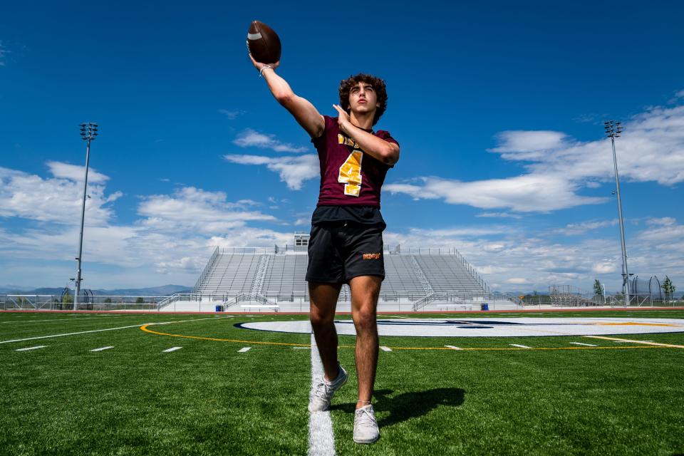 Windsor's Kyle Phelps (4) throws a football at the Coloradoan's high school football Media Day at PSD Stadium on August 1, 2023.