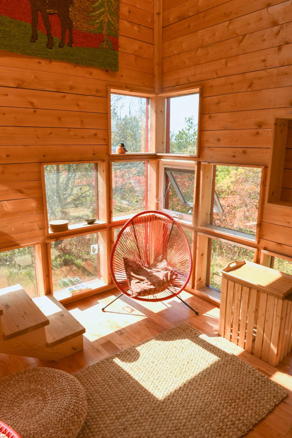 A view of a chair with light coming in from the windows inside