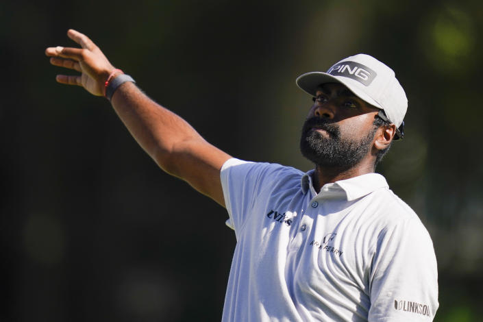 Sahith Theegala signals the direction of his ball after teeing off on the 18th hole during the third round of the Travelers Championship golf tournament at TPC River Highlands, Saturday, June 25, 2022, in Cromwell, Conn. (AP Photo/Seth Wenig)