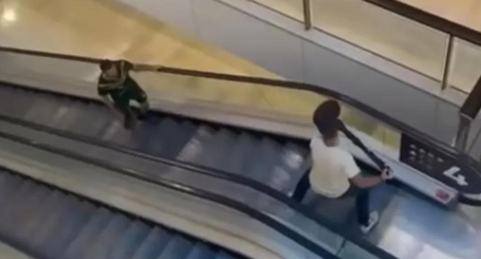 A brave man wards off the knifeman with a bollard at Westfield Bondi Junction. 