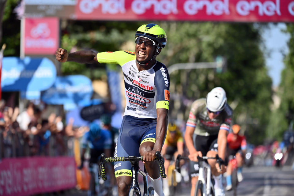 Eritrea's Biniam Girmay celebrates as he crosses the finish line of the 10th stage of the Giro D'Italia cycling race from Pescara to Jesi, Italy, Tuesday, May 17, 2022. (Massimo Paolone/LaPresse via AP)