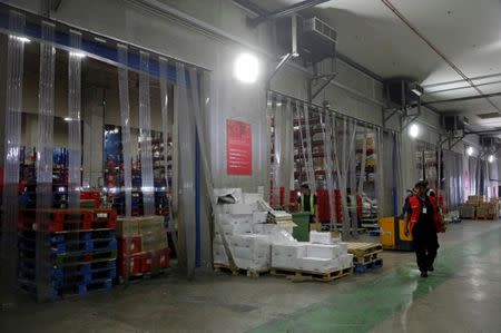 Employees work at RedMart's fulfillment centre in Singapore September 22, 2017. REUTERS/Edgar Su